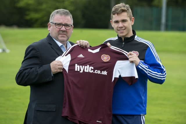 Sam Nicholson (right) is joined by HYDC Director Calum Robertson as they launch the strips for Youth Cup Final. Picture: SNS