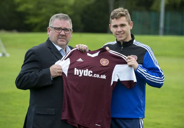 Sam Nicholson (right) is joined by HYDC Director Calum Robertson as they launch the strips for Youth Cup Final. Picture: SNS