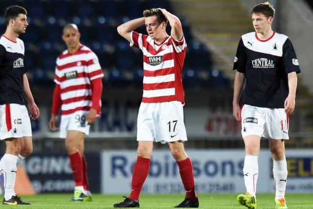 Hamilton's Louis Longridge cuts a dejected figure at full-time after Falkirk had equalisied to draw the tie. Picture: SNS