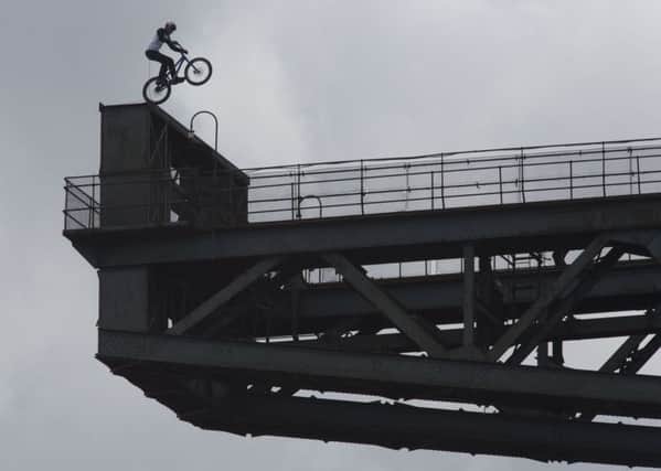 Scottish stunt cyclist Danny MacAskill on the Finnieston Crane. Picture: Mick McGurk