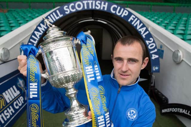 Dave Mackay gets his hands on the Scottish Cup. Picture: Steve Welsh