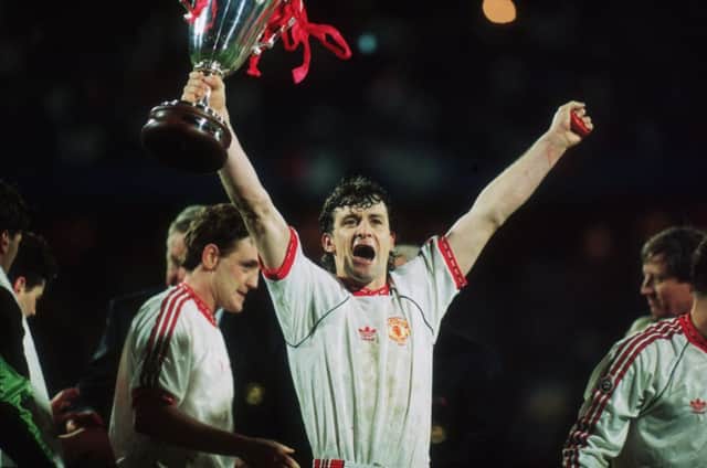On this day in 1991, Mark Hughes of Manchester United raises the European Cup Winners Cup after his team beat Barcelona. Picture: Getty