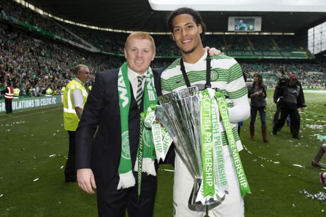 Neil Lennon and Virgil van Dijk celebrate with the Premiership trophy. Picture: SNS