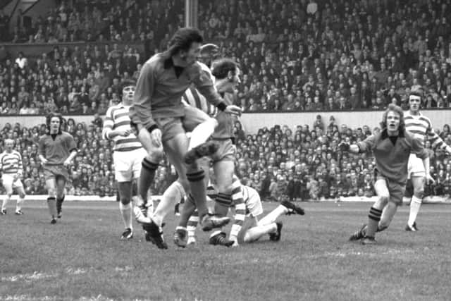 Dundee Uniteds George Fleming and Andy Gray take on the Celtic defence at Hampden. Picture: Allan Milligan