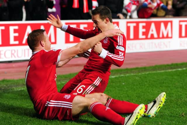 Peter Pawlett, right, will join the Scotland squad along with Mark Reynolds. Picture: Ian Rutherford