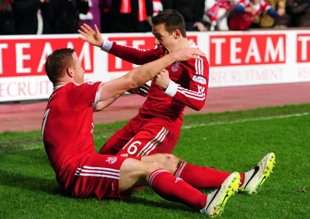 Peter Pawlett, right, will join the Scotland squad along with Mark Reynolds. Picture: Ian Rutherford