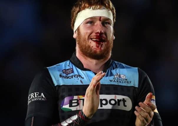 A battered and bloodied, but proud, Rob Harley.  Picture: Ian MacNicol/Getty