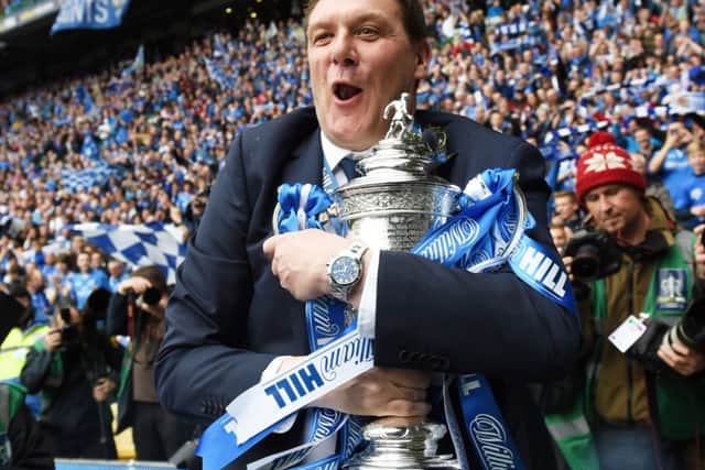 St Johnstone boss Tommy Wright takes a tight grip of the Scottish Cup.  Picture: Craig Williamson