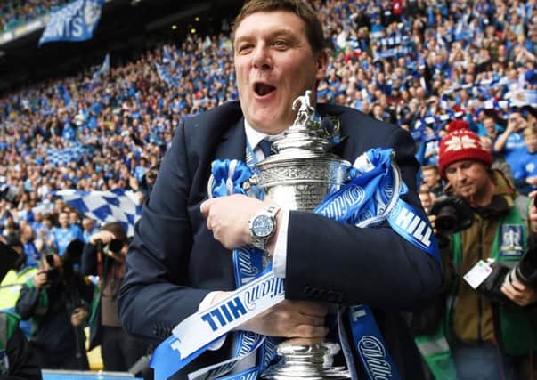 St Johnstone boss Tommy Wright takes a tight grip of the Scottish Cup.  Picture: Craig Williamson