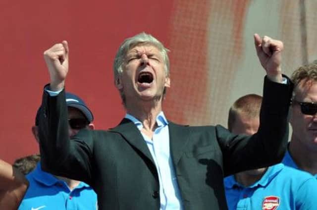 Arsene Wenger celebrates outside the Emirates Stadium during the FA Cup winners parade in London. Picture: PA