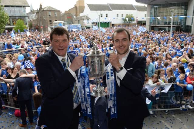 Club manager Tommy Wright (left) and captain Dave Mackay show off the Scottish Cup. Picture: SNS