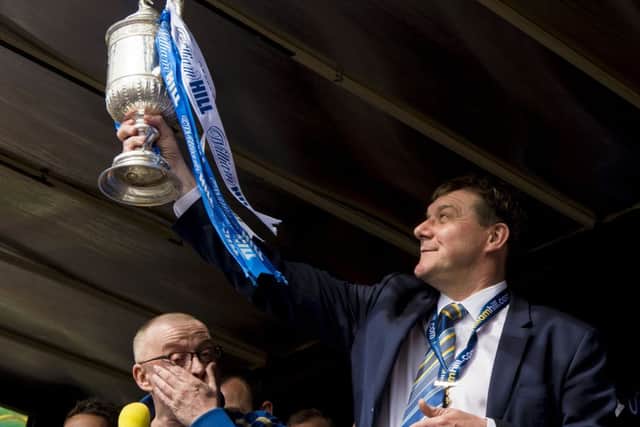St Johnstone manager Tommy Wright shows off the Scottish Cup to ther Perth public as Stuart Cosgrove looks on. Picture: SNS