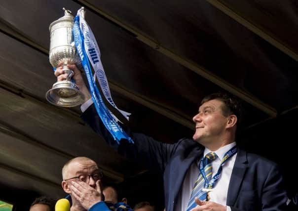St Johnstone manager Tommy Wright shows off the Scottish Cup to ther Perth public as Stuart Cosgrove looks on. Picture: SNS