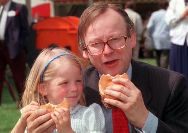 Agriculture minister John Gummer and his daughter Cordelia eat beefburgers in 1990 to allay fears about mad cow disease. Picture: PA