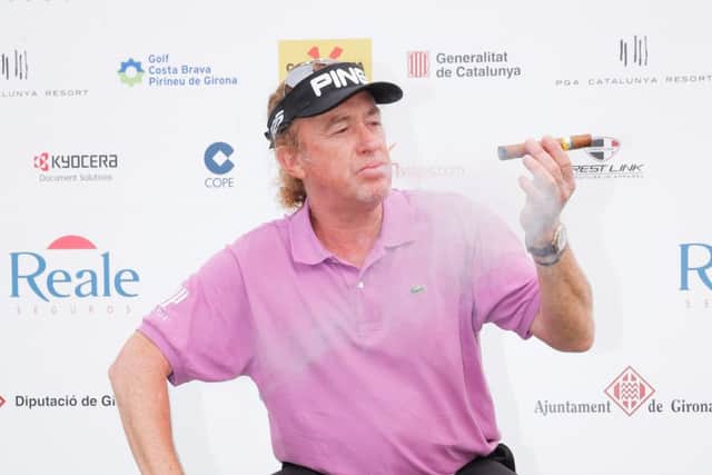 Miguel Angel Jimenez of Spain smokes a cigar as he poses with the trophy. Picture: Getty