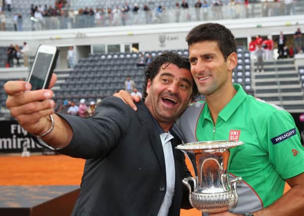 Italian skiing legend Alberto Tomba takes a selfie with Novak Djokovic after the Serb defeated Rafael Nadal in Rome. Picture: Getty