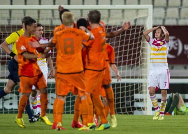 Scotland star Aidan Nesbitts face says it all as the skilled and pacey Dutch celebrate their fourth goal. Picture: SNS