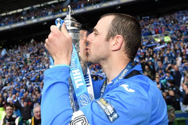 St Johnstone captain Dave Mackay celebrates with the William Hill Scottish Cup trophy. Picture: SNS