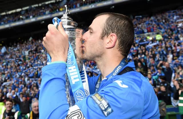 St Johnstone captain Dave Mackay celebrates with the William Hill Scottish Cup trophy. Picture: SNS