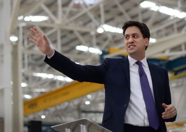 Ed Miliband will promise to establish a 'clear link' between the minimum wage and the earnings of other workers. Picture: PA