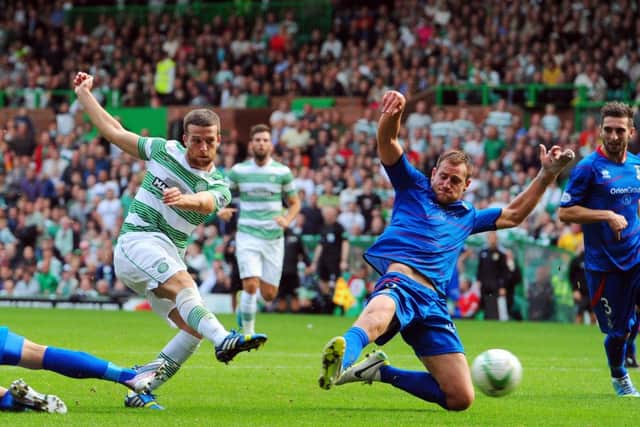 Gary Warren challenges Adam Matthews of Celtic in a match at Celtic Park in August 2013. Picture: Robert Perry