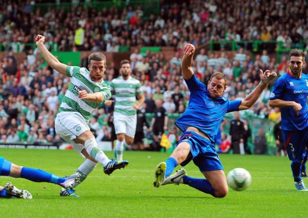 Gary Warren challenges Adam Matthews of Celtic in a match at Celtic Park in August 2013. Picture: Robert Perry