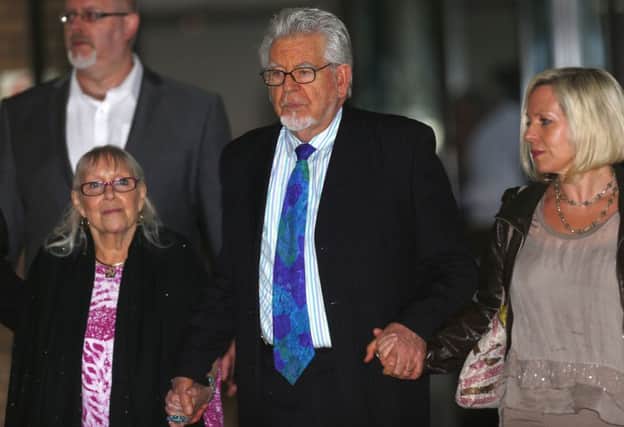 Rolf Harris leaves Southwark Crown Court, with daughter Bindi and wife Alwen Hughes. Picture: Reuters