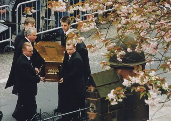 The coffin of Labour leader John Smith is carried into Cluny Parish Church, Edinburgh, for his funeral on this day in 1994