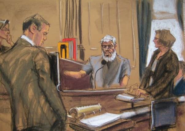 Judge Katherine Forrest looks on as Abu Hamza, centre, replies to questions from his defence lawyer. Picture: Reuters