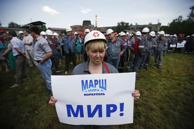 A steel worker takes part in a peace rally at a factory in Mariupol yesterday. Picture: Maxim Zmeyev/Reuters