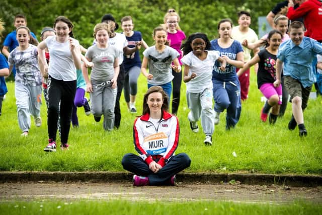 European U23 1500m Bronze medallist Laura Muir joins kids at Paul's (Whiteinch) Primary RC School. Picture: SNS