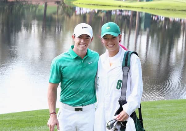 Caroline Wozniacki caddies for Rory McIlroy at the start of the US Masters last month. Picture: Getty