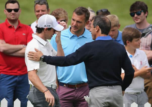 Rory McIlroy chats to former footballers Andriy Shevchenko and Gianfranco Zola at Wentworth. Picture: Getty