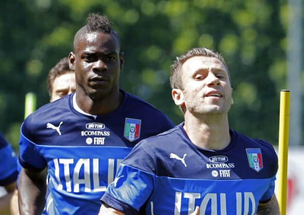 Mario Balotelli, left, trains with his Italy team-mates at their base in Florence yesterday. Picture: Reuters