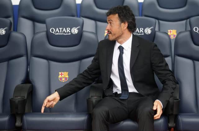 Luis Enrique sits on the Barca bench after signing a two-year deal. Picture: Reuters
