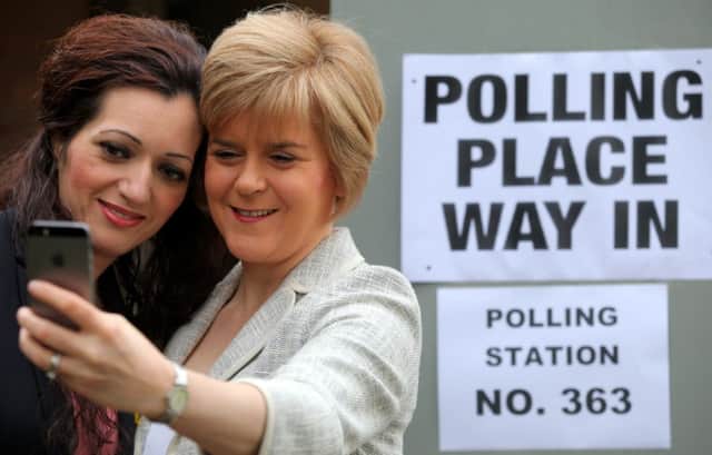 Tasmina Ahmed-Sheikh and Nicola Sturgeon pose for a selfie after voting. Picture: Hemedia
