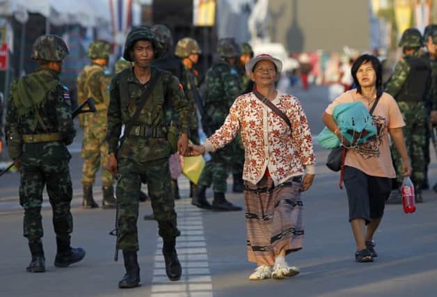 A Thai soldier with a pro-government Redshirt. Picture: Reuters