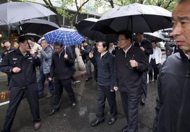 Security minister Guo Shengkun, right, and local party secretary Zhang Chunxian at the scene. Picture: AP