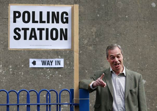 Ukip leader Nigel Farage poses for photographs as he leaves a polling station near Biggin Hill, in Kent. Picture: Getty