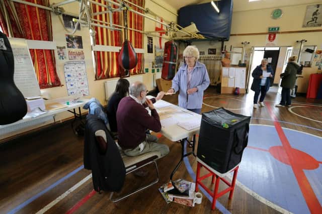 A voter prepares to cast her vote yesterday at East Hull Boxing Club. Picture: Getty