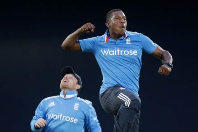 Englands Chris Jordan jumps to celebrate beside Ian Bell, left, after taking the wicket of Sri Lankas Dinesh Chandimal. Picture: AP