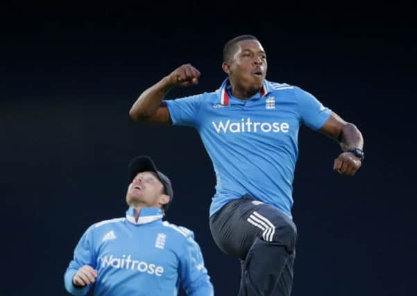 Englands Chris Jordan jumps to celebrate beside Ian Bell, left, after taking the wicket of Sri Lankas Dinesh Chandimal. Picture: AP