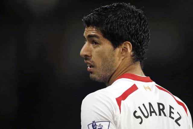 Luis Suarez is hopeful of making the World Cup, but angry fans have hit out at Paul Dummett. Picture: Getty