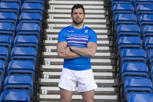 Sean Lamont on the steps of Ibrox, where he will represent Scotland at the Commonwealth Games. Picture: PA