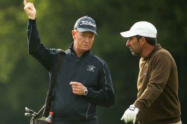 Coach Jamie Gough working with Jose-Maria Olazabal at Wentworth 
last week. Picture: Getty
