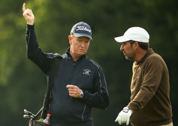 Coach Jamie Gough working with Jose-Maria Olazabal at Wentworth 
last week. Picture: Getty