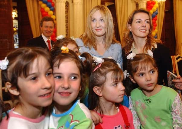 J.K. Rowling with Romanian children from the Robin Hood Child Protection Center in Bucharest (2006). Picture: Reuters