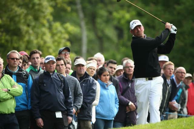 Thomas Bjorn hits an approach shot during his second-round 72 yesterday. Picture: Getty