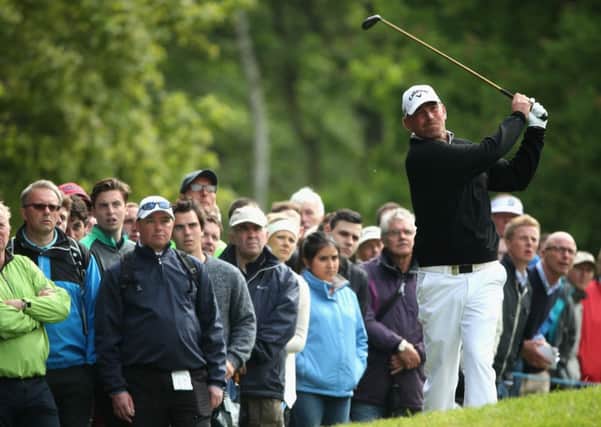 Thomas Bjorn hits an approach shot during his second-round 72 yesterday. Picture: Getty