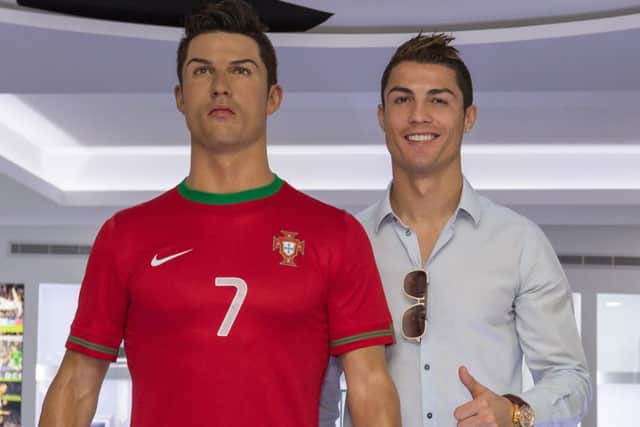 Ronaldo poses with a wax statue of himself at the opening of his museum. Picture: Gregorio Cunha